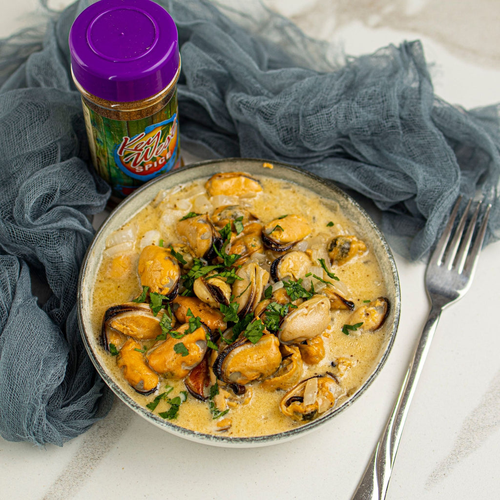 Fresh Key West Spice 0 Mile Seafood mussels in a bowl, showcasing plump, cooked shellfish ready for culinary use.