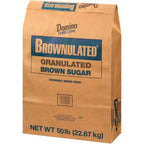 Key West Spice Domino Brownulated brown sugar in a 50 lb bag, showing golden-brown granulated sugar for baking and cooking.