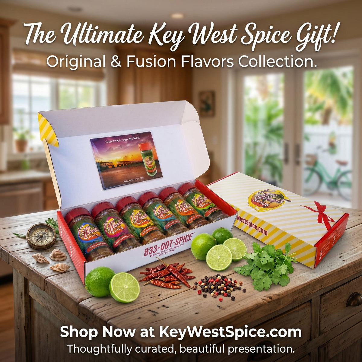 An open gift box of Key West Spice Collection spices displayed on a rustic wooden table, surrounded by limes, red chilies, peppercorns, and cilantro. The scene is set in a warm kitchen interior with promotional text overlays.