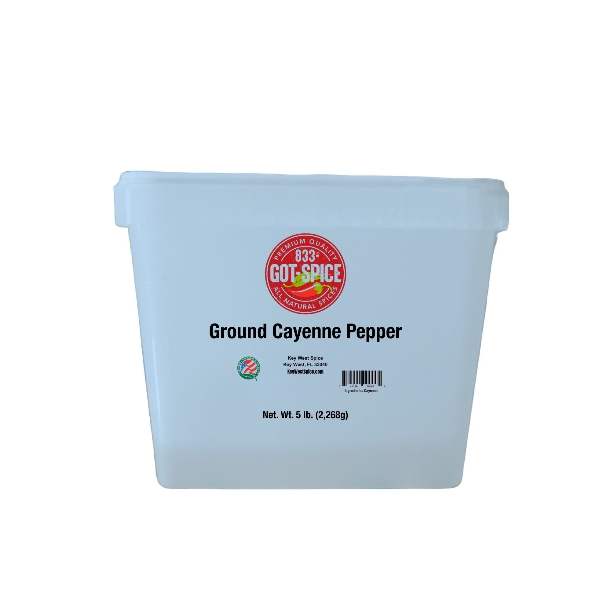 Ground cayenne pepper from Key West Spice in a plastic pail, showing bright red, finely ground chili powder on the surface.