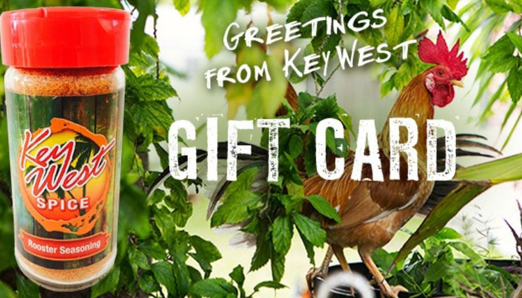 Key West Spice The Gift of Flavor e-gift card displayed on a wooden table with festive decorations.