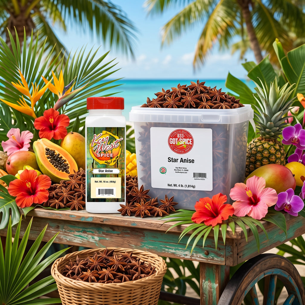 A clear plastic tub and a white spice jar of Spice Star Anise are displayed on a rustic teal cart surrounded by tropical fruits, flowers, and palm leaves against a beach backdrop.