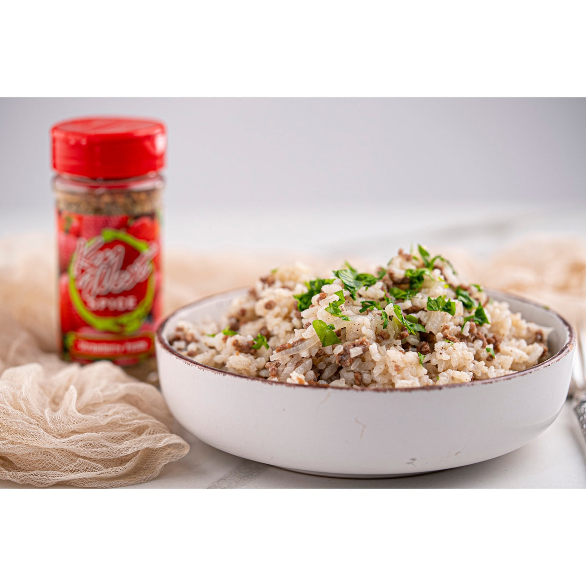 Key West Spice Strawberry Fusion salt-free and sugar-free seasoning rice blend in a clear container with visible strawberries.