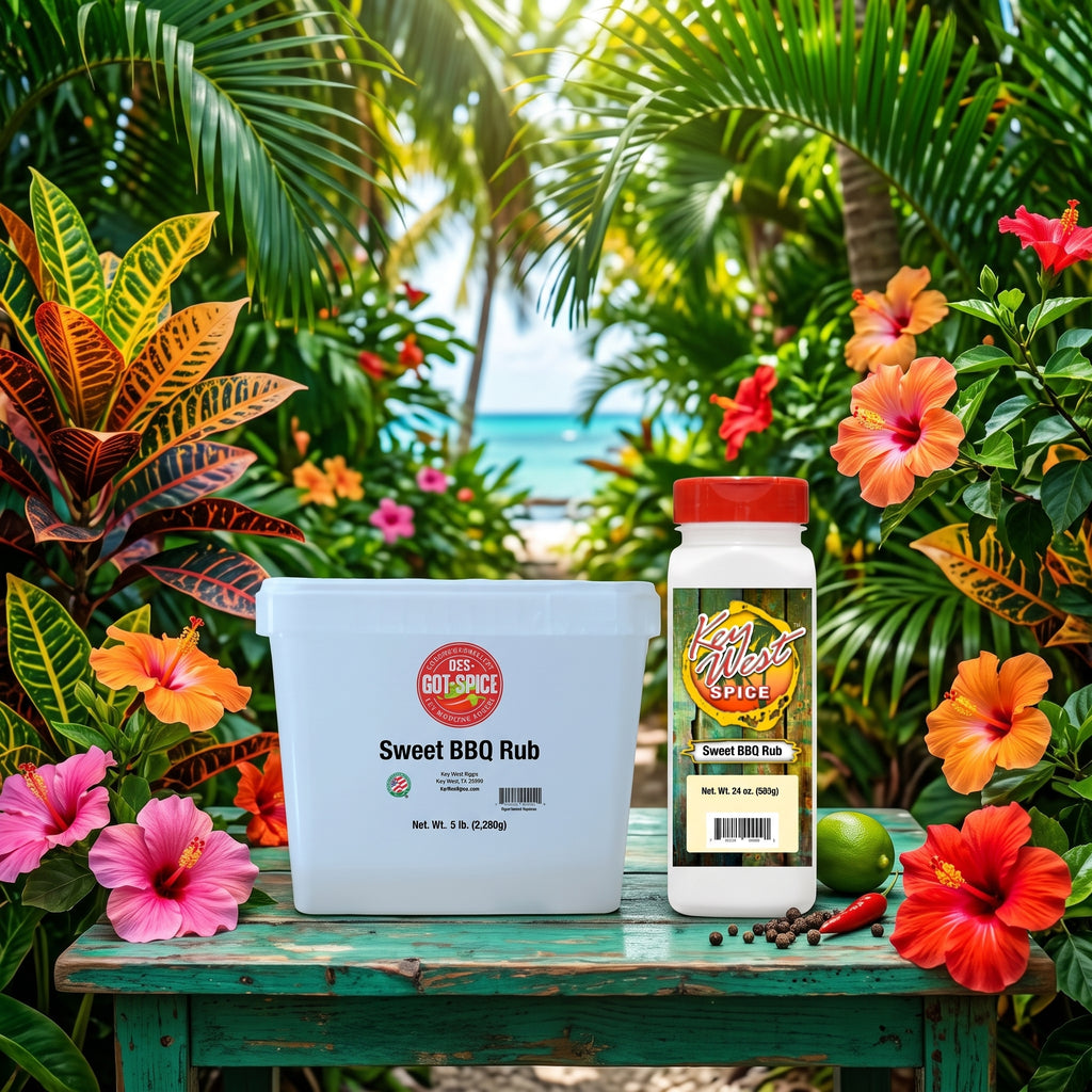 Two bottles of Sweet BBQ Rub products displayed on a rustic green table surrounded by tropical flowers and palm leaves, with a beach scene in the background.