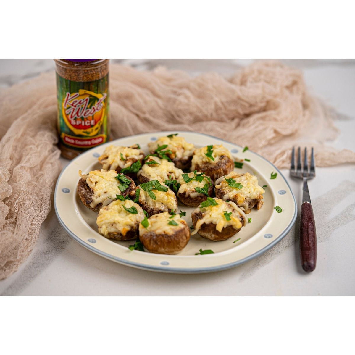 Stuffed mushrooms topped with Back Country Cajun blackening seasoning by Key West Spice, showcasing spicy, flavorful seasoning on appetizer mushrooms.