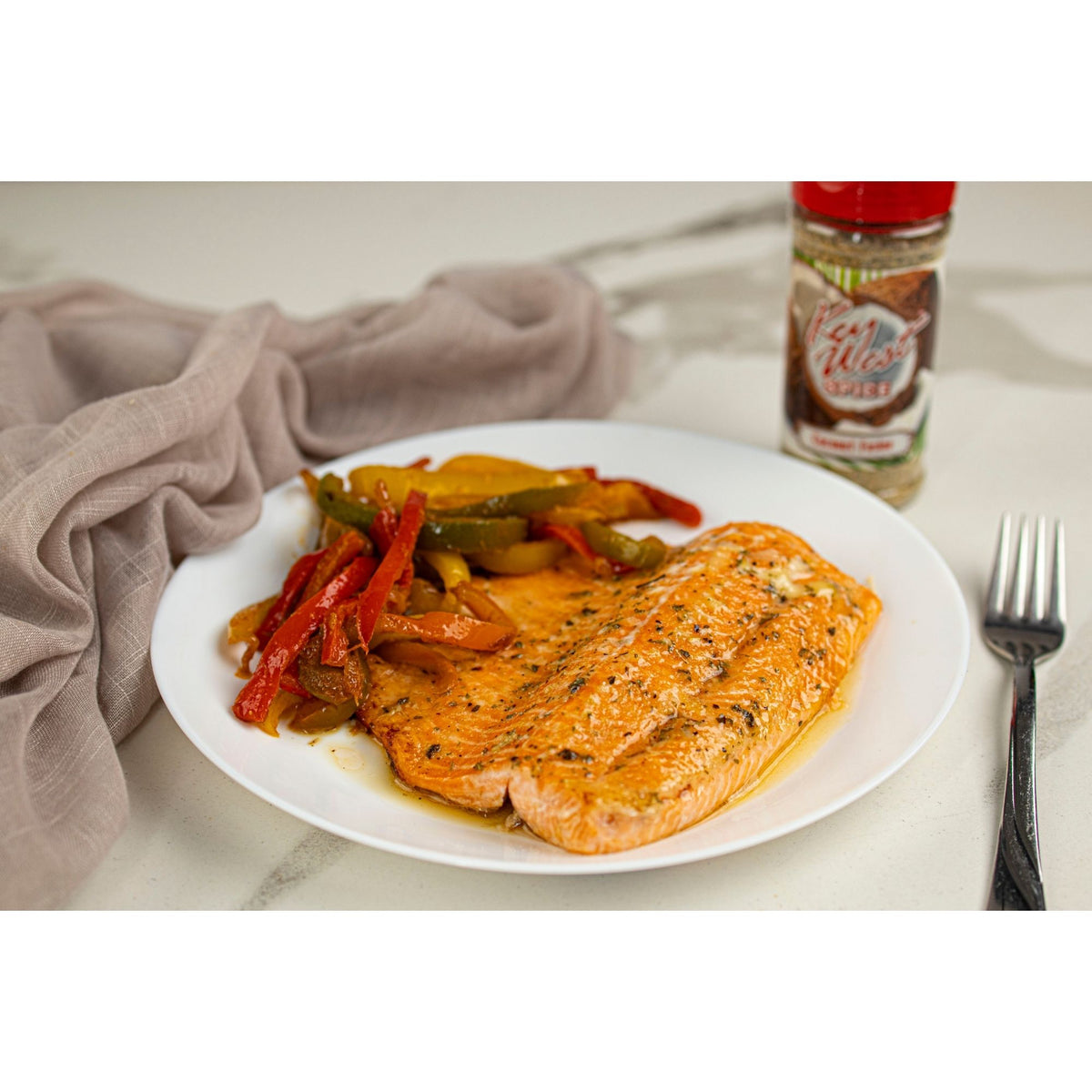 Key West Spice Coconut Fusion seasoning on salmon fillet, salt-free and sugar-free blend for healthy cooking.