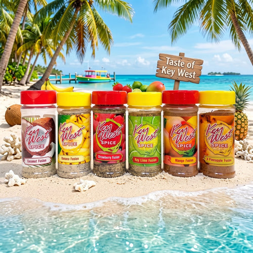 Assorted case of 12 Key West Spice seasonings with colorful spice blends in small jars on a wooden surface.