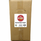 Bulk gourmet black pepper from Key West Spice, showing whole black peppercorns in a clear container.