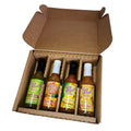 Assorted Key West Spice Fusion Hot Sauce Gift Box with five 4/5 oz bottles in vibrant packaging.