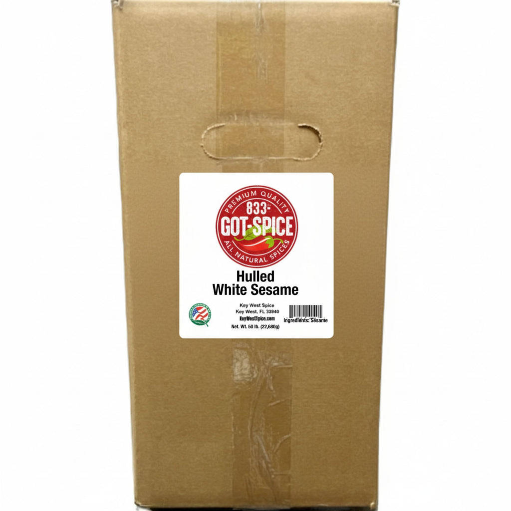 Bulk Key West Spice hulled white sesame seeds in a clear jar, showing small, smooth, white sesame seeds ready for cooking or baking.