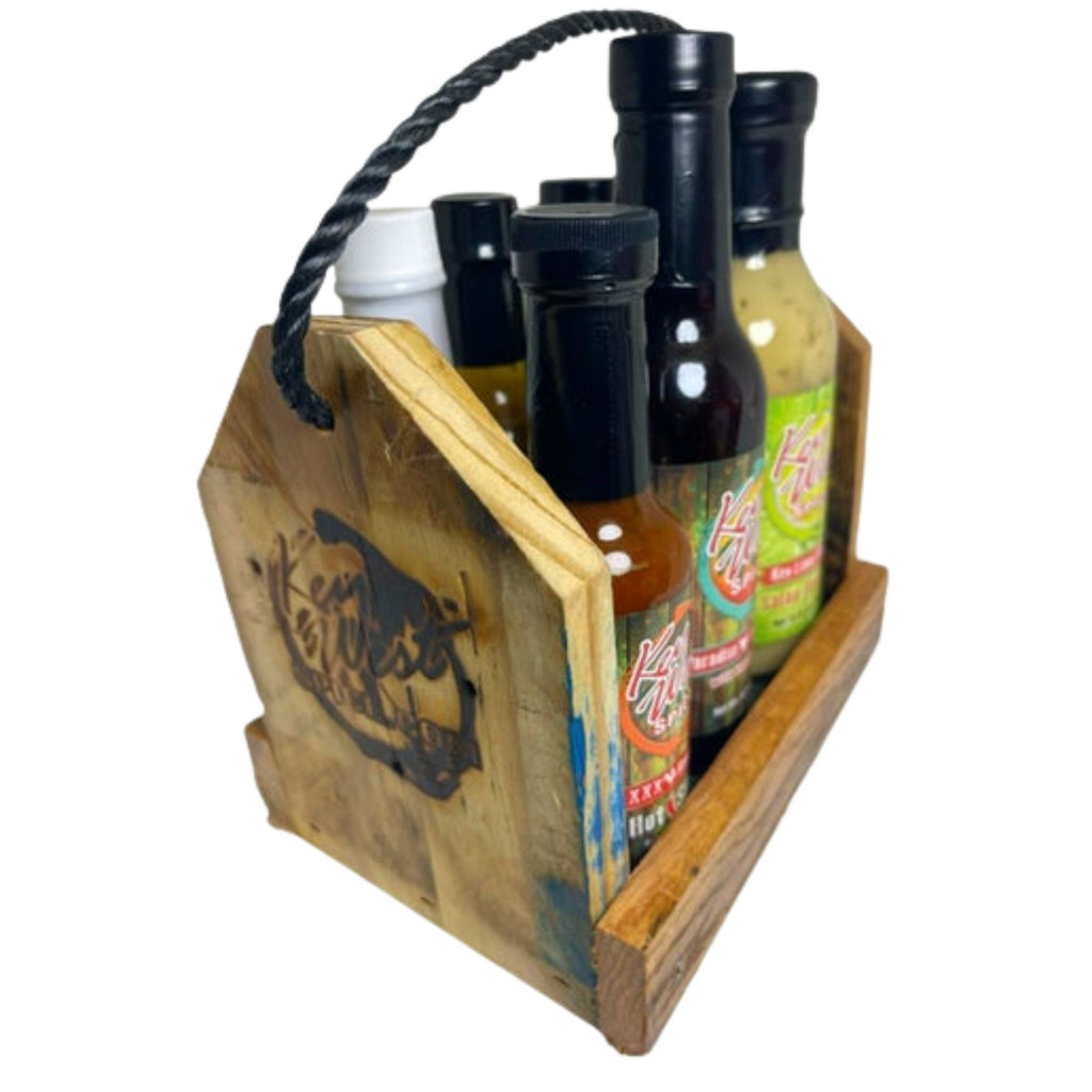 Reclaimed wood spice caddy and hot sauce rack by Key West Spice, featuring multiple compartments for kitchen organization.
