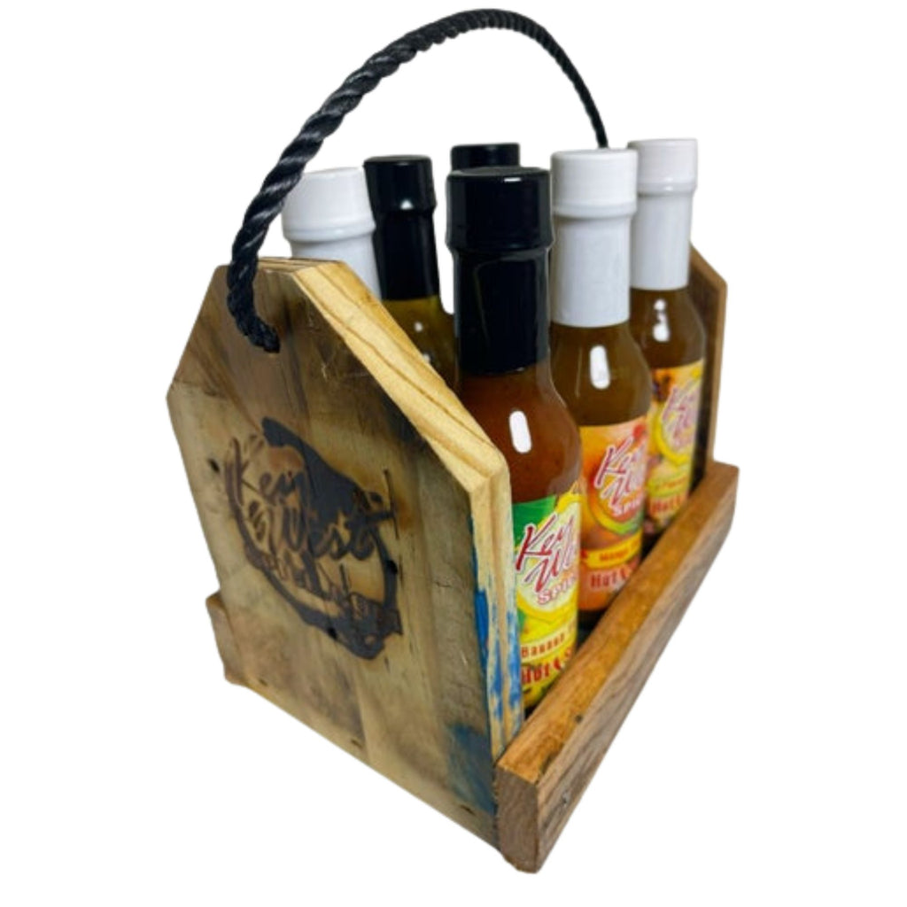 Reclaimed wood spice caddy and hot sauce rack from Key West Spice, ideal for organizing spices and condiments in the kitchen.