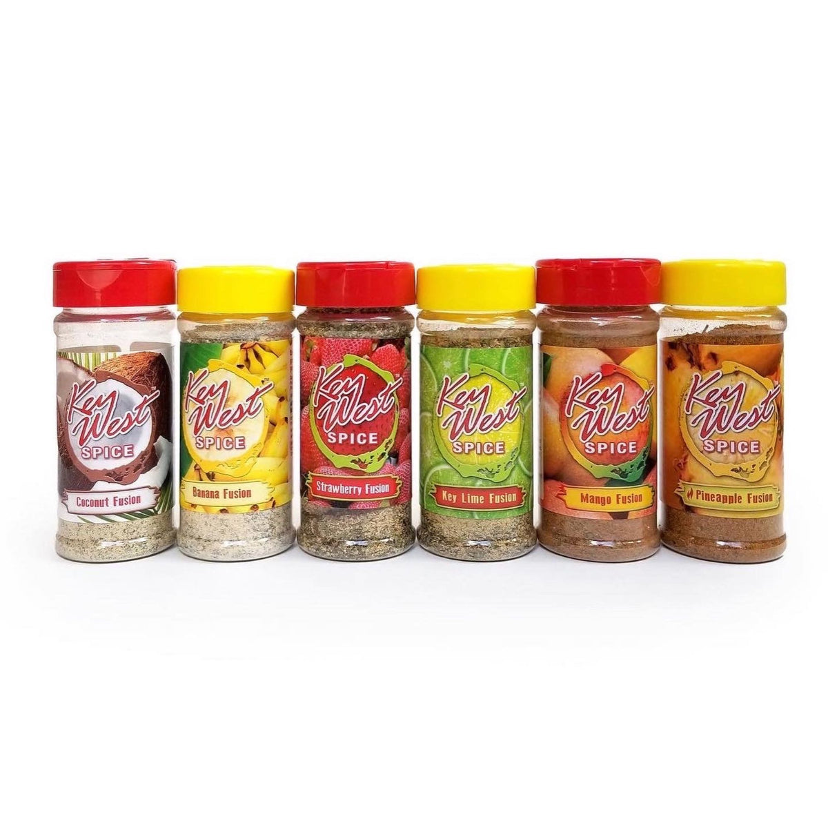 Assorted case of 6 Key West Spice Fusion flavors, featuring colorful spice blends in small jars on a wooden surface.