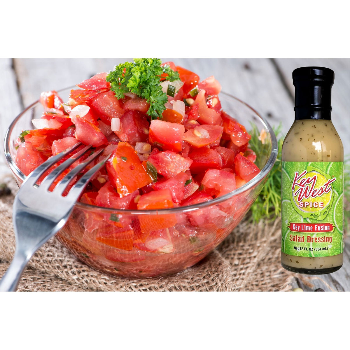 Key West Spice Key Lime Fusion Salad Dressing bottle next to fresh tomatoes, highlighting citrus-infused salad dressing flavor.