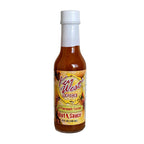 Key West Spice Pineapple Fusion Hot Sauce bottle, 5 oz., featuring a pineapple-themed label and vibrant red hot sauce inside.