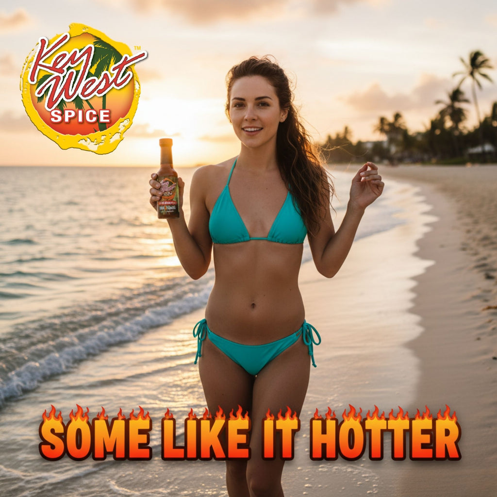 Key West Spice XXX Rooster Hot Sauce bottle on a beach scene with ocean and sand background.
